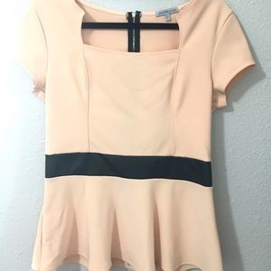 Women’s Peplum Top with faux leather detailing.